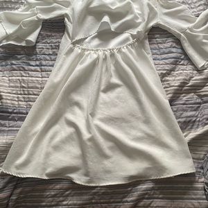 Whit dress with back out and flared sleeves size M